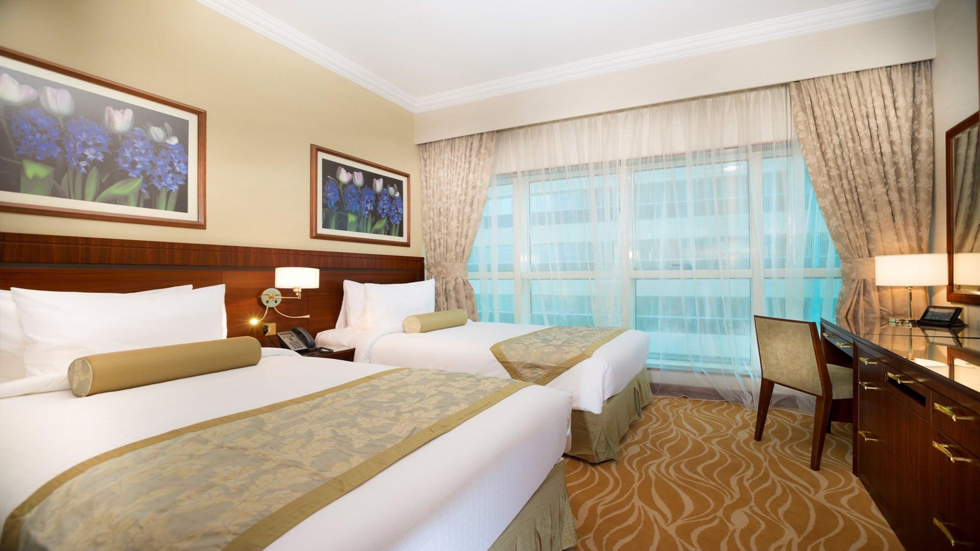 Grand Mercure Residencia Abu Dabi Exterior foto A room at the hotel