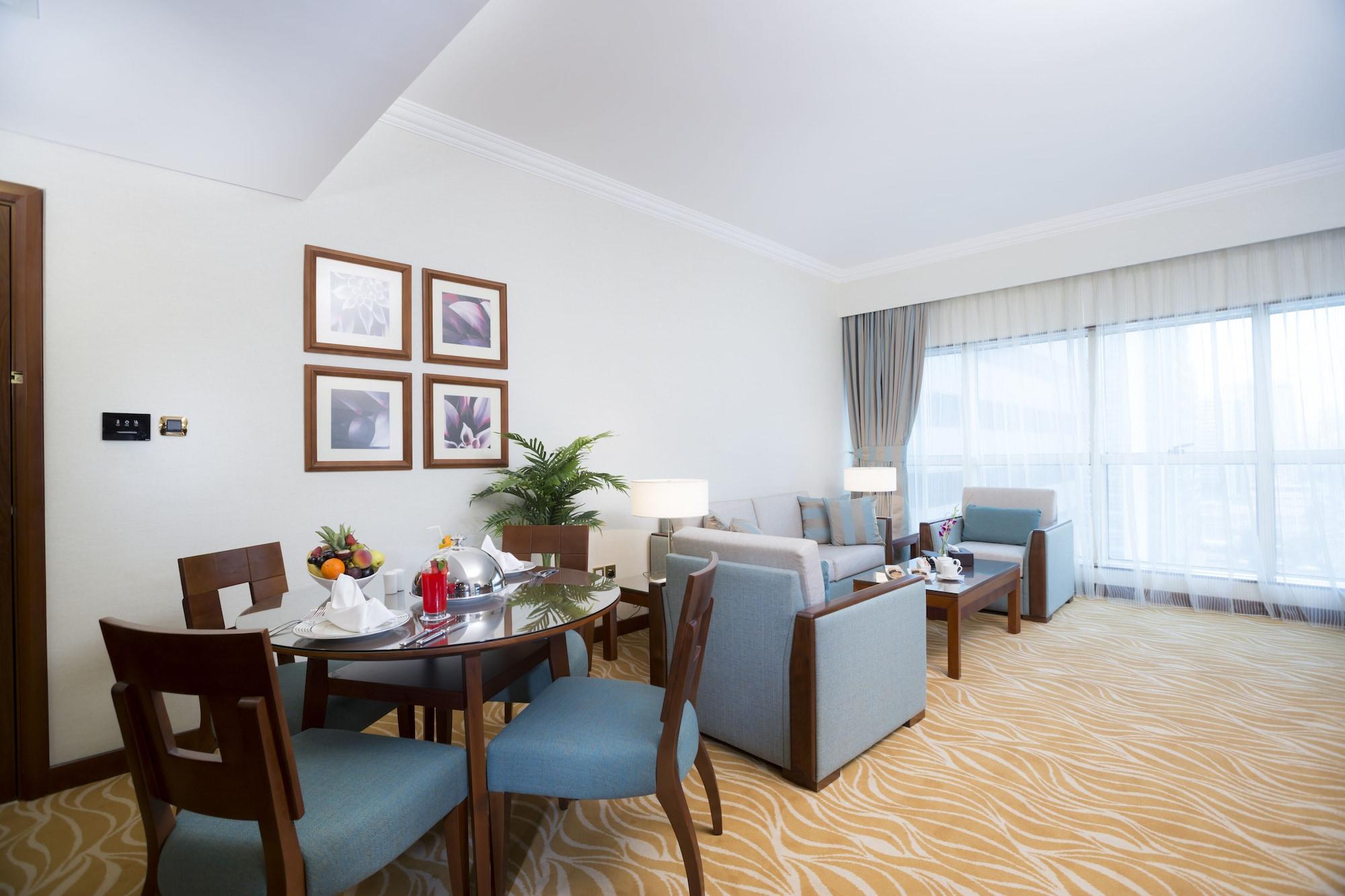 Grand Mercure Residencia Abu Dabi Exterior foto A living room at the hotel